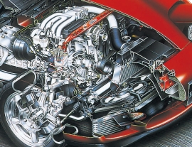 A Mazda RX-7  III.gen. turbó zsúfolt motortere.